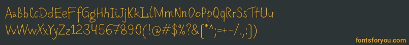 Romochka Font – Orange Fonts on Black Background