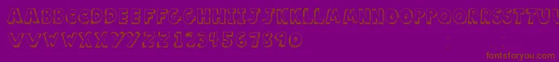 フォントScoolarTfb – 紫色の背景に茶色のフォント