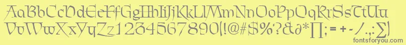 フォントChevalierDb – 黄色の背景に灰色の文字