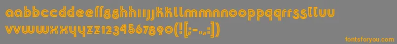 フォントK22Plural – オレンジの文字は灰色の背景にあります。