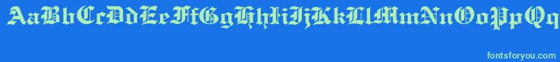 OldCologneRegular-Schriftart – Grüne Schriften auf blauem Hintergrund