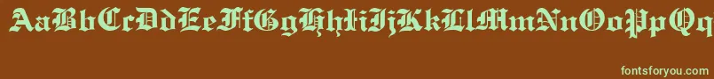 OldCologneRegular-Schriftart – Grüne Schriften auf braunem Hintergrund