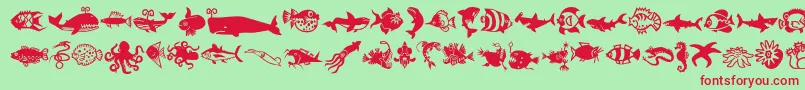 Minipicslilfishies-Schriftart – Rote Schriften auf grünem Hintergrund