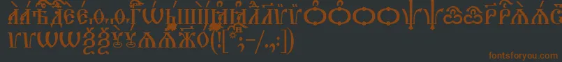 TriodionCapsUcs Font – Brown Fonts on Black Background
