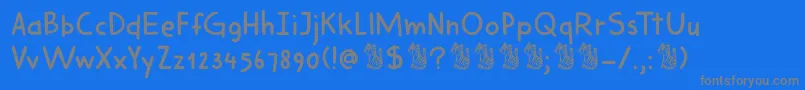 フォントDkHarimauDua – 青い背景に灰色の文字