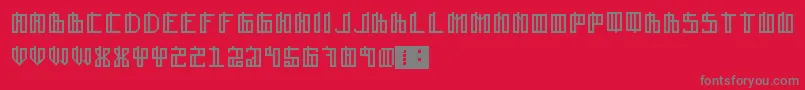 Lain-fontti – harmaat kirjasimet punaisella taustalla