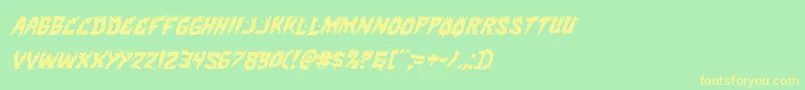 フォントHotkissital – 黄色の文字が緑の背景にあります