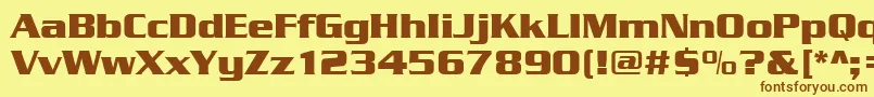 フォントSerpentinedeebol – 茶色の文字が黄色の背景にあります。