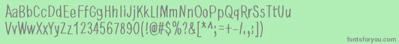 フォントDancingInTheDark – 緑の背景に灰色の文字