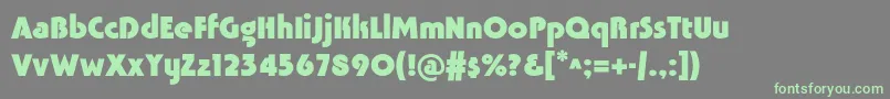 フォントTavridacBold – 灰色の背景に緑のフォント