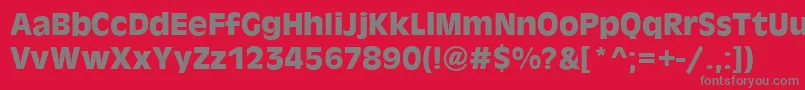 AntigoneBold-fontti – harmaat kirjasimet punaisella taustalla