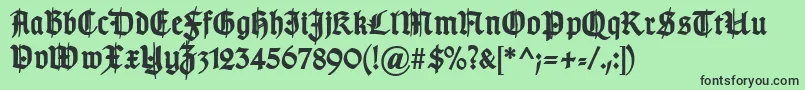 Fonte TypographergotischSchmuckBold – fontes pretas em um fundo verde