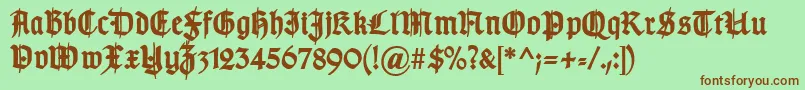 Fonte TypographergotischSchmuckBold – fontes marrons em um fundo verde