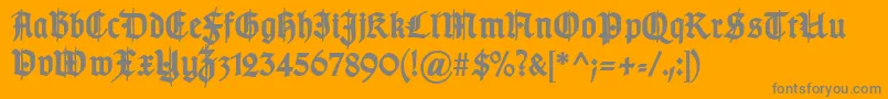 TypographergotischSchmuckBold-Schriftart – Graue Schriften auf orangefarbenem Hintergrund