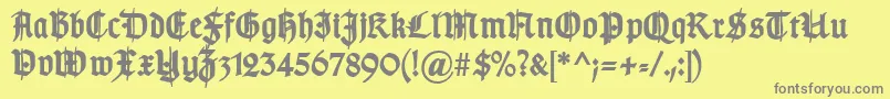 TypographergotischSchmuckBold-Schriftart – Graue Schriften auf gelbem Hintergrund