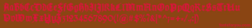 フォントTypographergotischSchmuckBold – 赤い文字が茶色の背景にあります。