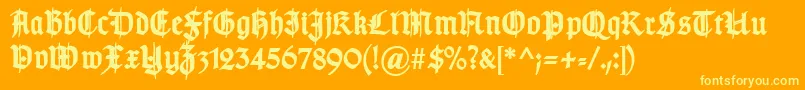 TypographergotischSchmuckBold-Schriftart – Gelbe Schriften auf orangefarbenem Hintergrund