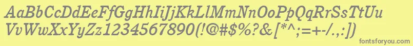ItcCushingLtMediumItalic-fontti – harmaat kirjasimet keltaisella taustalla