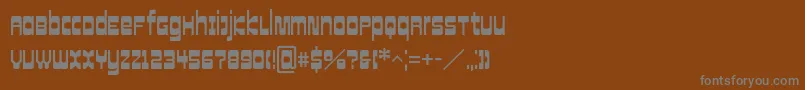 CowboyHippiePro-Schriftart – Graue Schriften auf braunem Hintergrund