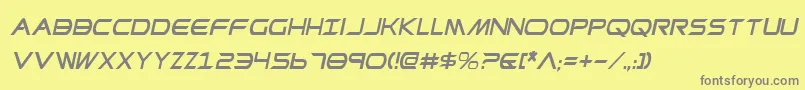 PrometheanCondensedItalic-fontti – harmaat kirjasimet keltaisella taustalla