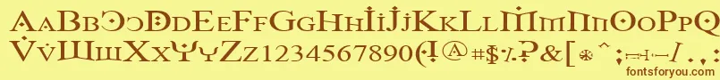 フォントFoy1wid – 茶色の文字が黄色の背景にあります。