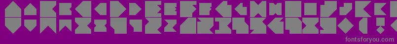 Angleblock-fontti – harmaat kirjasimet violetilla taustalla