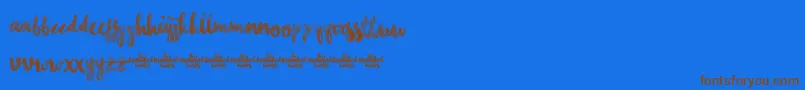 フォントChasingEmbersDemoVersion – 茶色の文字が青い背景にあります。