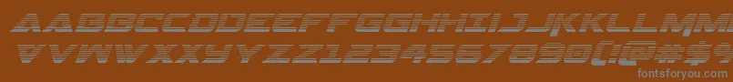 Gemina2gradital-fontti – harmaat kirjasimet ruskealla taustalla