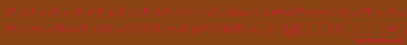 フォントCailloux – 赤い文字が茶色の背景にあります。