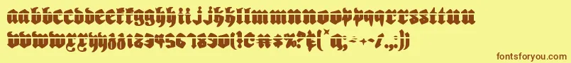 フォントBiergartenl – 茶色の文字が黄色の背景にあります。