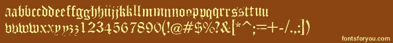 PuppeteerRegular-fontti – keltaiset fontit ruskealla taustalla