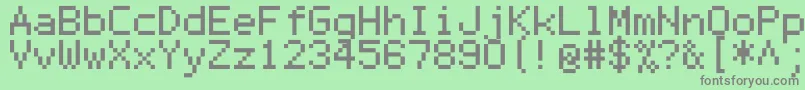 Mono0755-fontti – harmaat kirjasimet vihreällä taustalla
