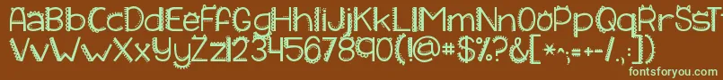 フォントKgiliketomoveit – 緑色の文字が茶色の背景にあります。