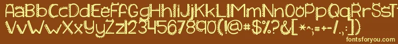 Kgiliketomoveit-Schriftart – Gelbe Schriften auf braunem Hintergrund