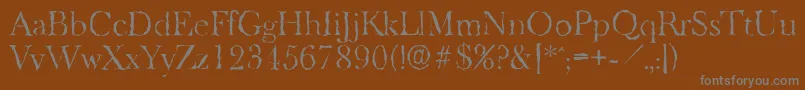 BaskeroldrandomLightRegular-fontti – harmaat kirjasimet ruskealla taustalla