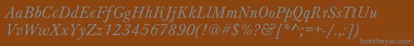 HoundsItalic-fontti – harmaat kirjasimet ruskealla taustalla