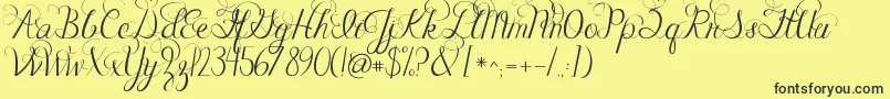 Jandacelebrationscript-Schriftart – Schwarze Schriften auf gelbem Hintergrund