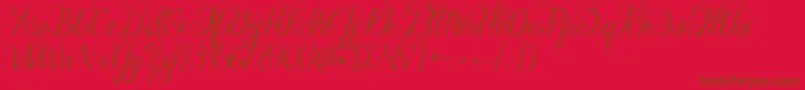 Jandacelebrationscript-Schriftart – Braune Schriften auf rotem Hintergrund