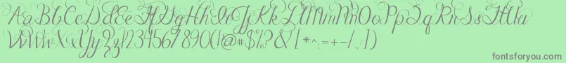 Fonte Jandacelebrationscript – fontes cinzas em um fundo verde
