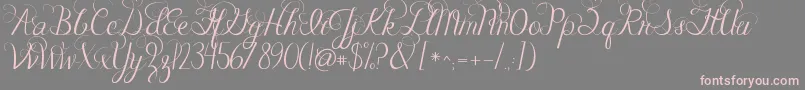 Jandacelebrationscript-fontti – vaaleanpunaiset fontit harmaalla taustalla