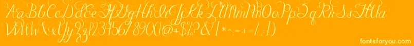 Jandacelebrationscript-Schriftart – Gelbe Schriften auf orangefarbenem Hintergrund