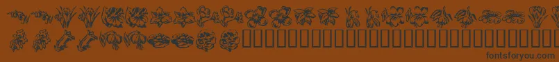 フォントKrBeautifulFlowers2 – 黒い文字が茶色の背景にあります