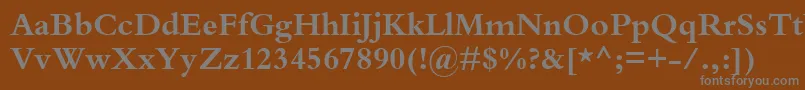 KuriakosBlackSsiBold-fontti – harmaat kirjasimet ruskealla taustalla