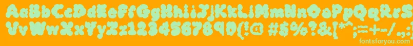 MckloudBlack-Schriftart – Grüne Schriften auf orangefarbenem Hintergrund