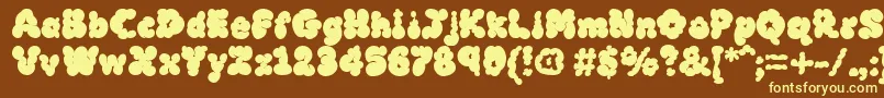 MckloudBlack-fontti – keltaiset fontit ruskealla taustalla