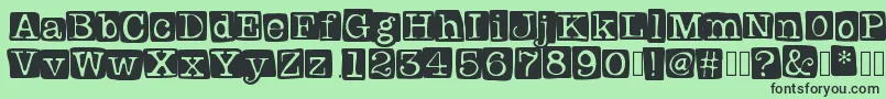 Badlystamped Font – Black Fonts on Green Background