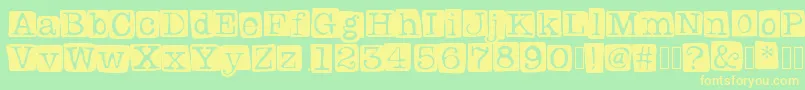 Badlystamped-Schriftart – Gelbe Schriften auf grünem Hintergrund