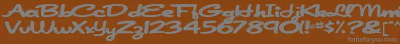 Japanscript911Bold-fontti – harmaat kirjasimet ruskealla taustalla