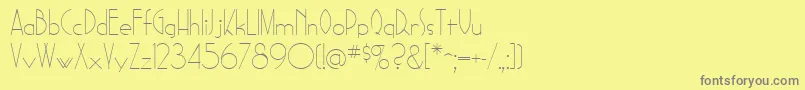 フォントSadelleRegular – 黄色の背景に灰色の文字