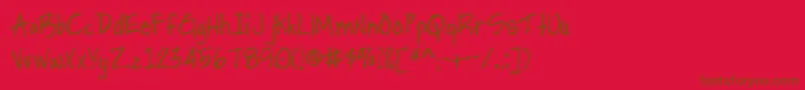 Fonte Handprinting – fontes marrons em um fundo vermelho